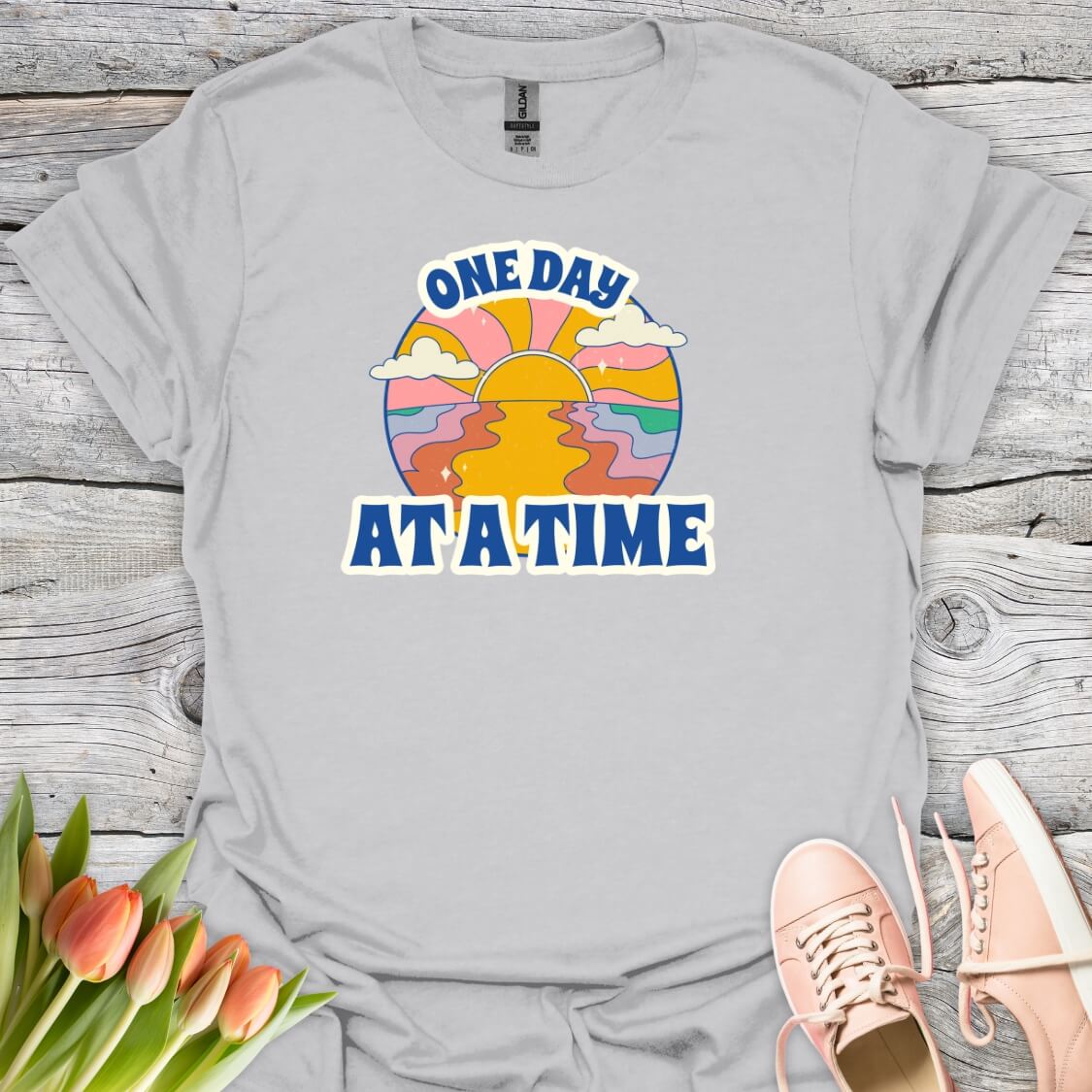 Grey t-shirt with 'One Day At A Time' graphic design