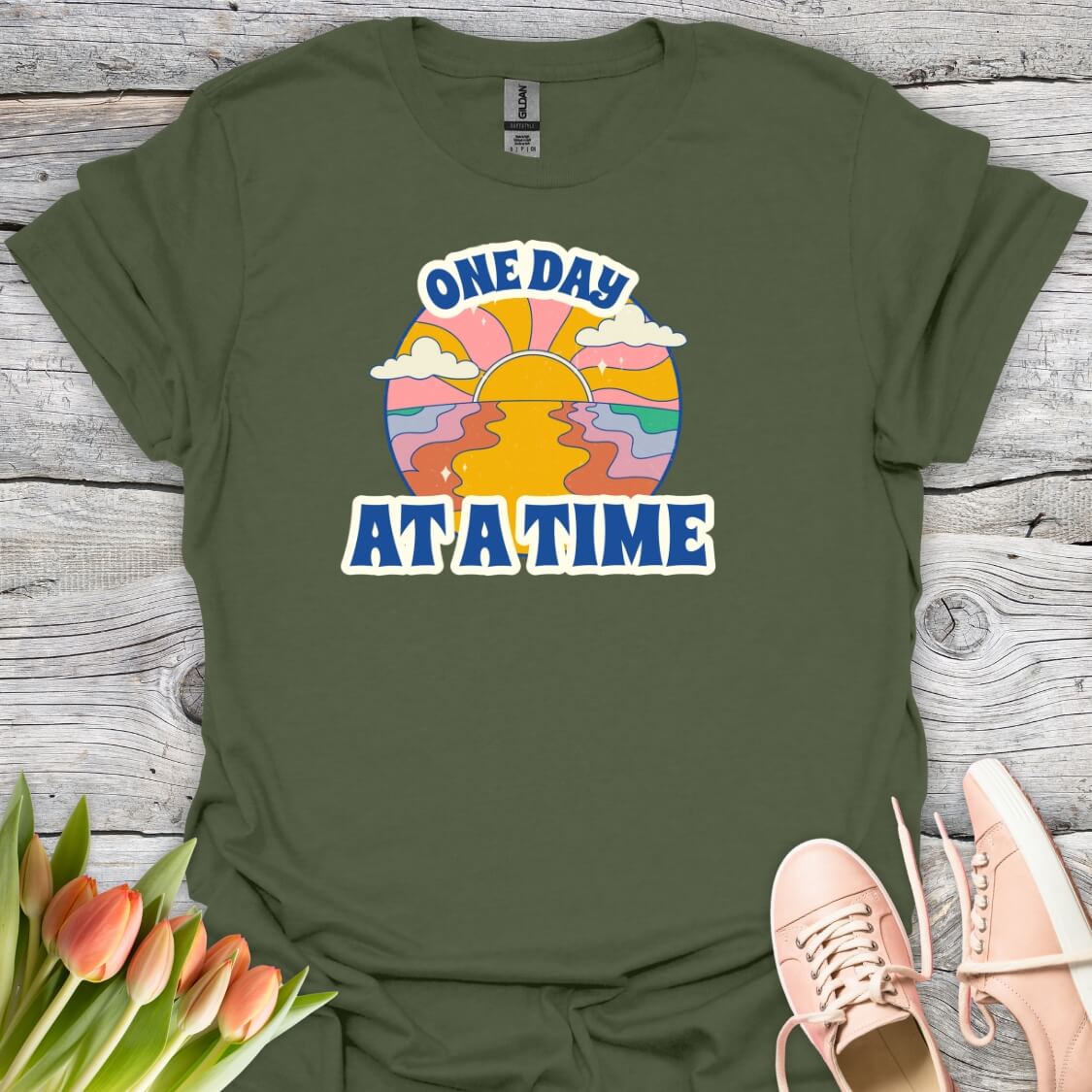Military green t-shirt with 'One Day At A Time' graphic design