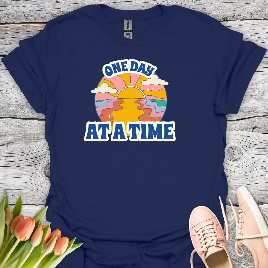 Navy blue t-shirt with 'One Day At A Time' graphic design